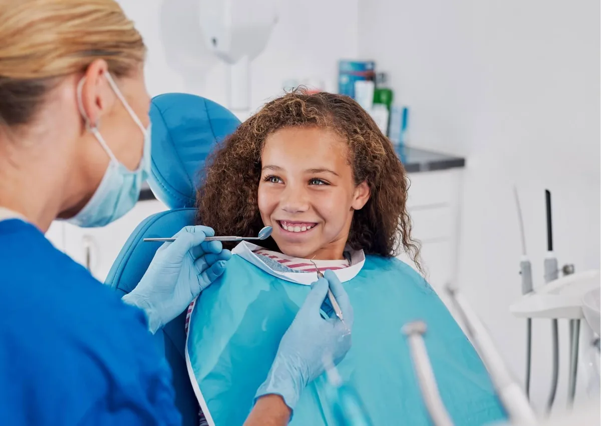 Patient receiving a dental checkup as part of preventive care to help prevent cavities.